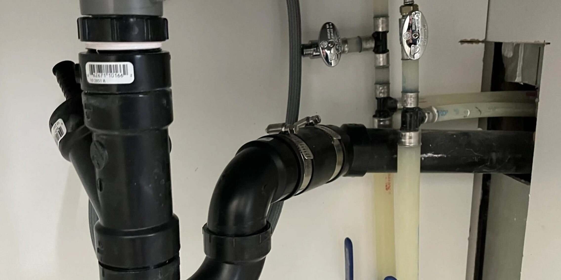 sink-drain-and-supply Sink drain and water supply with water shut offs.